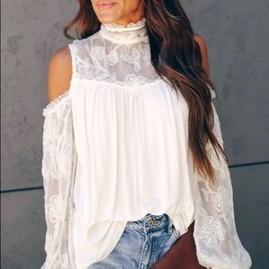 Cream colored drop shoulder top